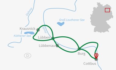 Radrouten-Karte um die Region Lübben Karte mit Radrouten in grünen Kreisen zwischen Lübben, Lübbenau und Cottbus. Zeigt Flüsse, Seen und eine kleine Deutschland-Übersicht.