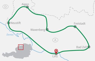 Karte mit Radroute von Neustift über Aigen, Waxenberg, Freistadt, Bad Zell nach Linz entlang der Donau. Österreich ist grau dargestellt.