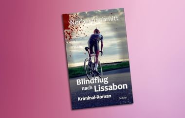 Buchcover zeigt einen Radfahrer auf einer Straße mit rotem Spritzer-Effekt. Titel 'Blindflug nach Lissabon' von Norbert Schmitt, Kriminal-Roman.